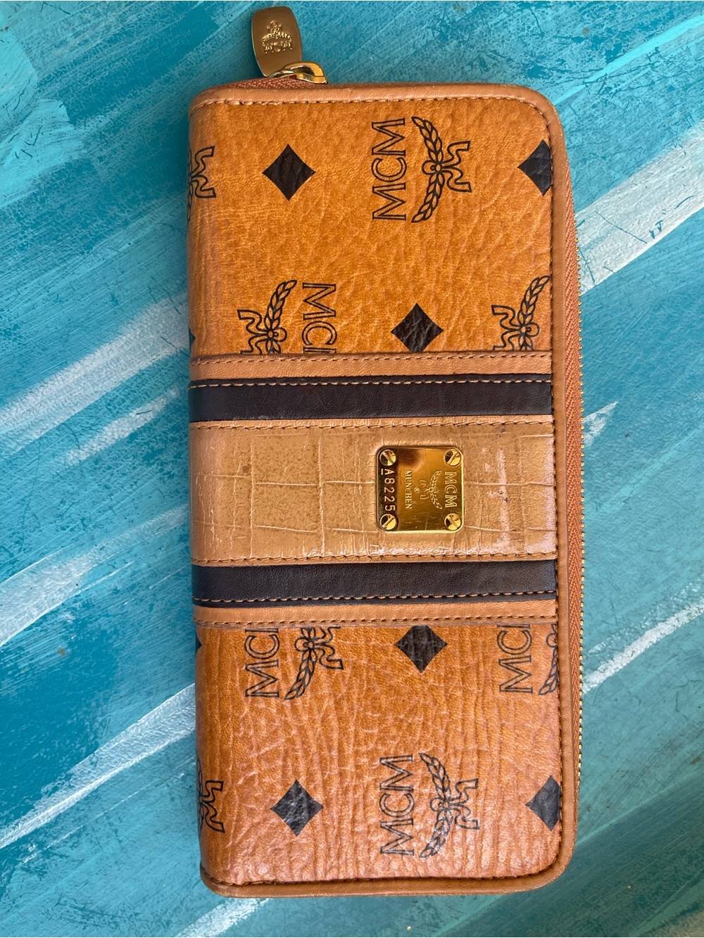MCM Cognac Logo Zip Wallet with Dark Brown Stripes and Gold Plaque